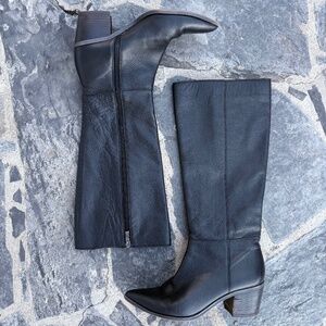Sleek black knee-high leather boots